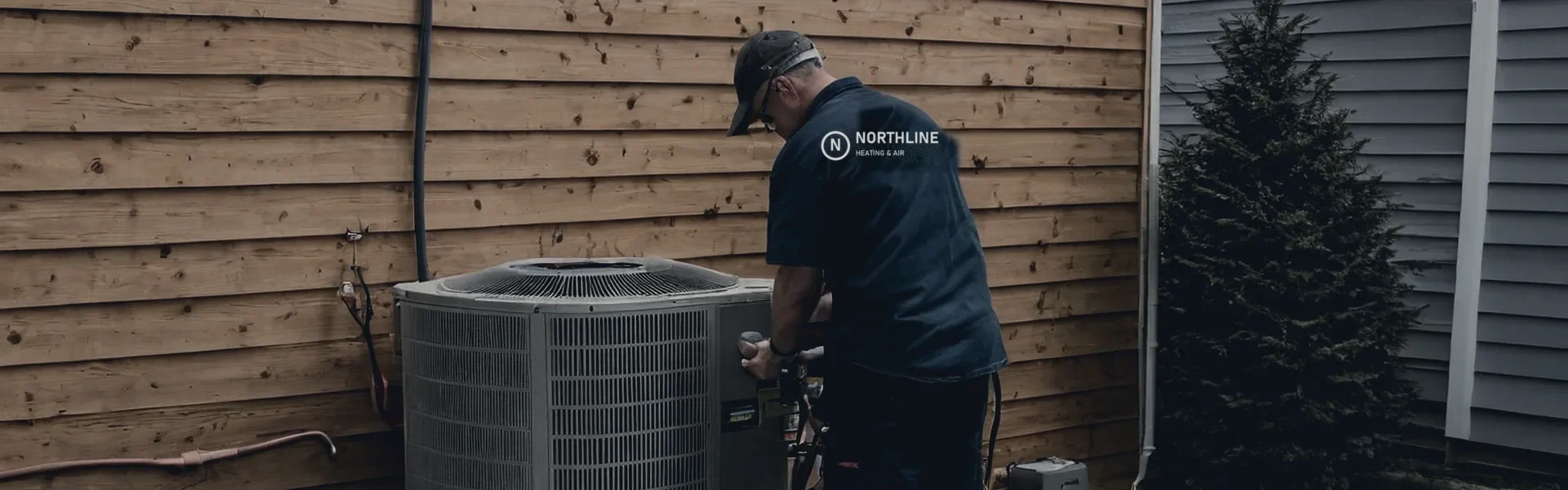 A technician installing a heat pump